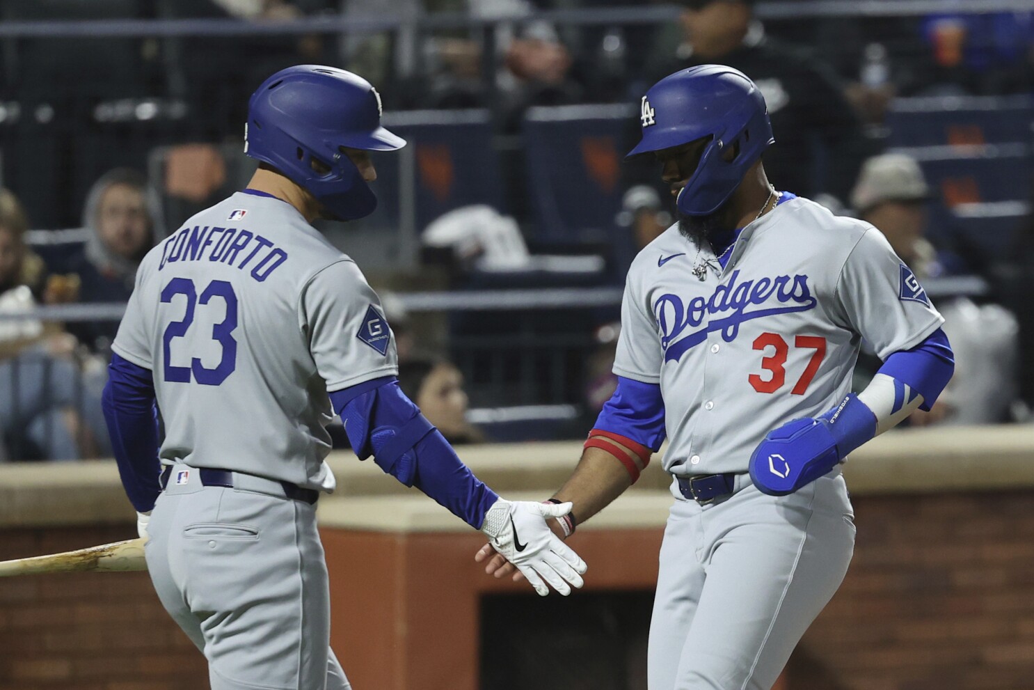 Hernández sends Dodgers past Mets 7-5 in 13 innings in wild and rainy NLCS rematch