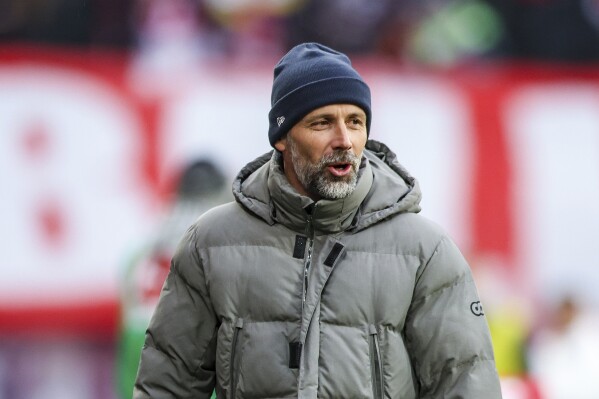 Leipzig's head coach Marco Rose arrives for the German Bundesliga soccer match between RB Leipzig and Eintracht Frankfurt in Leipzig, Germany, Saturday, Jan. 13, 2024. (Jan Woitas/dpa via AP)