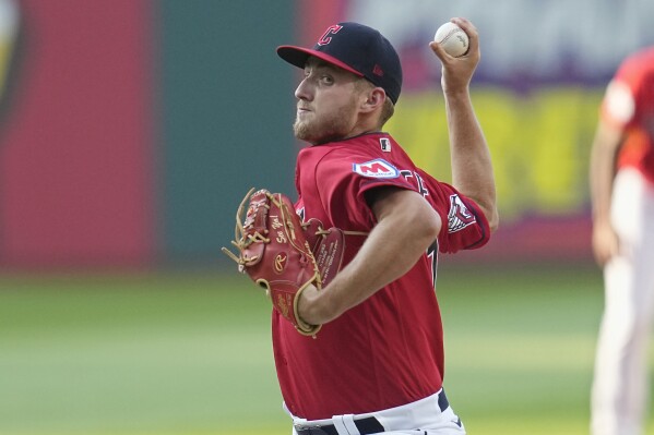 Cleveland Guardians' Tanner Bibee pitches in the second inning of a baseball game against the Philadelphia Phillies, Saturday, July 22, 2023, in Cleveland. (AP Photo/Sue Ogrocki)
