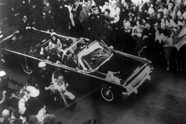 
              This image provided by the Warren Commission is  an overhead view of President John F. Kennedy's car in Dallas motorcade on Nov. 22, 1963, and was the commission's Exhibit No. 698. Special agent Clinton J. Hill is shown riding atop the rear of the limousine. President Donald Trump is caught in a push-pull on new details of Kennedy’s assassination, jammed between students of the killing who want every scrap of information and intelligence agencies that are said to be counseling restraint. Some 2,800 other files on the assassination have now been made public, and they capture the frantic days following the Nov. 22, 1963 assassination.(Warren Commission via AP)
            