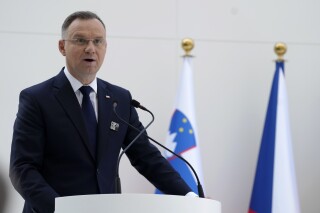FILE - Poland President Andrzej Duda speaks at an event in support of tripling global nuclear capacity by 2050 during at the COP28 U.N. Climate Summit, Saturday, Dec. 2, 2023, in Dubai, United Arab Emirates. Poland’s president says he intends to veto a spending bill which includes money for public media and raises for teachers, dealing a blow to the new pro-European Union government of Prime Minister Donald Tusk. President Andrzej Duda said Saturday, Dec. 23 he would veto the bill that includes 3 billion zlotys ($762 million) for public media and would propose a bill of his own. (AP Photo/Peter Dejong, file)