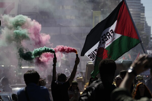 Demonstrators march during a pro-Palestinian protest, Saturday, Oct. 14, 2023, in Los Angeles. (AP Photo/Damian Dovarganes)