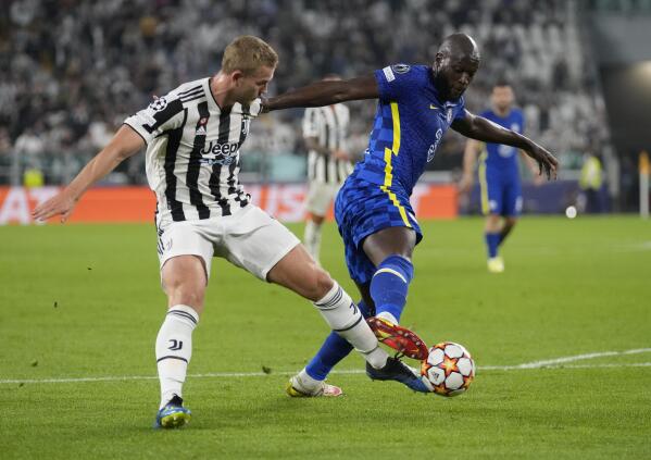 FILE - Juventus' Matthijs de Ligt, left, challenges for the ball with Chelsea's Romelu Lukaku during the Champions League group H soccer match between Juventus and Chelsea at the Allianz stadium in Turin, Italy, on Sept. 29, 2021. Chelsea's striker crisis is starting to ease. Romelu Lukaku and Timo Werner are back in training and expected to return soon even if the Premier League game at Leicester on Saturday is set to come too soon. Lukaku, who was Chelsea's record signing, and Werner have been out since sustaining injuries in the team's 4-0 victory over Malmo in the Champions League one month ago. (AP Photo/Antonio Calanni, File)
