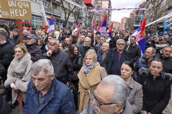FILE - Kosovo Serbs protest against a ban of the use of the Serbian currency in areas where they live, in the northern part of Kosovska Mitrovica, Kosovo, on Feb. 12, 2024. A senior U.S. official on Wednesday March 13, 2024 reassured top officials in Kosovo that the burdens of normalizing relations with longtime rival Serbia would be borne by both sides. Deputy Assistant Secretary of State Gabriel Escobar met with officials in Kosovo in the latest American effort to restart talks on normalizing ties between Kosovo and Serbia, after Kosovo made a controversial decision to ban ethnic Serbs in its territory from using the Serbian dinar. (AP Photo/Bojan Slavkovic, File)