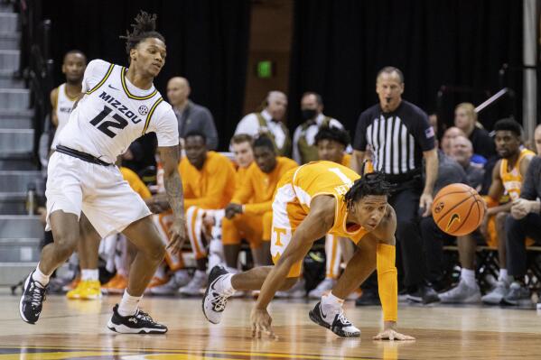 Tennessee's Kennedy Chandler, right, and Missouri's DaJuan Gordon, left, chase the ball during the first half of an NCAA college basketball game Tuesday, Feb. 22, 2022, in Columbia, Mo. (AP Photo/L.G. Patterson)