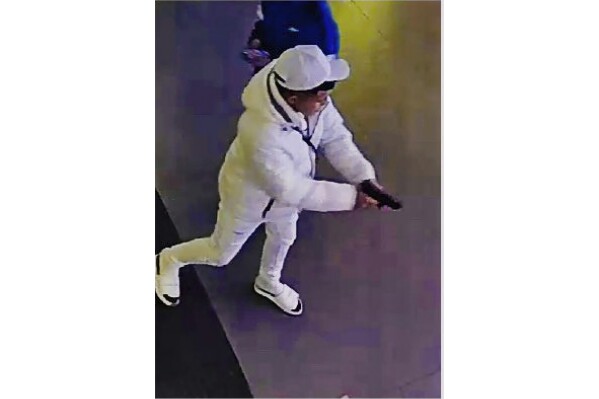 This surveillance image taken from a wanted poster provided by New York City Police Department Deputy Commissioner of Operations Kaz Daughtry on Friday, Feb. 9, 2024, shows a suspected shoplifter who shot a tourist in the leg inside a Times Square, New York, sporting goods store on Thursday, Feb. 8, 2024, who then fled into the street, stopping to shoot at a pursuing police officer. (New York City Police Department Deputy Commissioner of Operations Kaz Daughtry via AP)