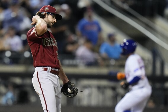 Arizona Diamondbacks starting pitcher Zac Gallen waits as New York Mets' Mark Vientos runs the bases on a two-run home run during the sixth inning of a baseball game Wednesday, Sept. 13, 2023, in New York. (AP Photo/Frank Franklin II)
