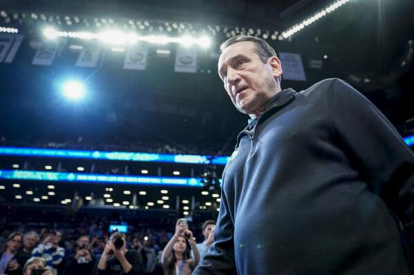 Duke head coach Mike Krzyzewski walks onto the court before the first half of an NCAA college basketball championship game against Virginia Tech of the Atlantic Coast Conference men's tournament, Saturday, March 12, 2022, in New York. (AP Photo/John Minchillo)