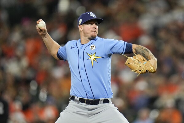 FILE -Tampa Bay Rays relief pitcher Chris Devenski throws in the ninth inning of a baseball game between the Baltimore Orioles and the Tampa Bay Rays, Friday, Sept. 15, 2023, in Baltimore. The Tampa Bay Rays signed reliever Chris Devenski to a $1.1 million, one-year contract on Tuesday, Dec. 5, 2023 with a club option for 2025. (APPhoto/Julio Cortez)