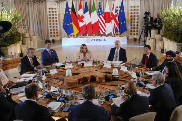U.S. President Joe Biden and leaders attend the Partnership for global infrastructure and investment event at the G7 world leaders summit at Borgo Egnazia, Italy, Thursday, June 13, 2024. (AP Photo/Domenico Stinellis)
