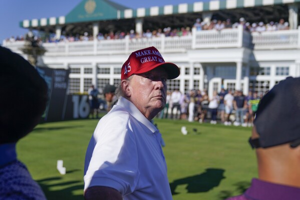 Former President Donald Trump looks over the crowd during the final round of the Bedminster Invitational LIV Golf tournament in Bedminster, N.J., Sunday, Aug. 13, 2023. (AP Photo/Seth Wenig)