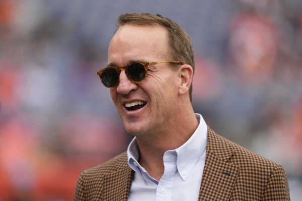 Hall of Fame quarterback Peyton Manning looks on before an NFL football game between the Denver Broncos and the Carolina Panthers, Oct. 27, 2024, in Denver. (AP Photo/Jack Dempsey, File)