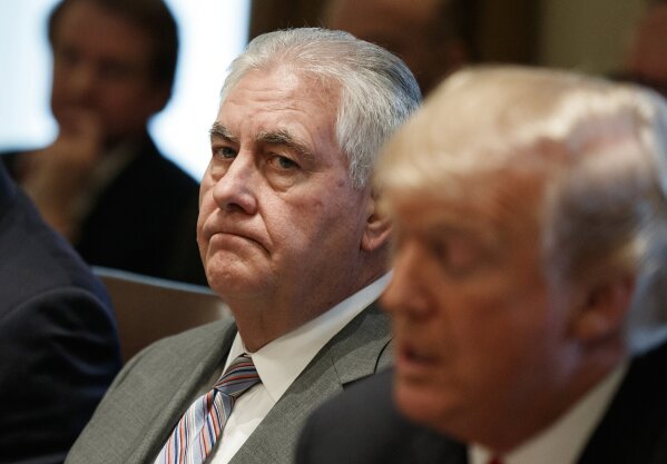 
              FILE - In this Jan. 10, 2018 file photo, Secretary of State Rex Tillerson listens as President Donald Trump speaks during a cabinet meeting at the White House in Washington. Tillerson is out as secretary of state. President Trump tweeted this morning that he’s naming CIA director Mike Pompeo to replace him. (AP Photo/Evan Vucci)
            
