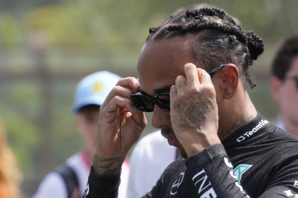 Mercedes driver Lewis Hamilton of Britain is on the starting grid before the Italy's Emilia Romagna Formula One Grand Prix race at the Dino and Enzo Ferrari racetrack in Imola, Italy, Sunday, May 19, 2024. (AP Photo/Luca Bruno, Pool)