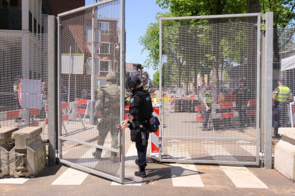 Security patrol around the perimeter of the venue ahead of the upcoming NATO summit in The Hague, Netherlands, Monday, June 23, 2025. (AP Photo/Patrick Post)