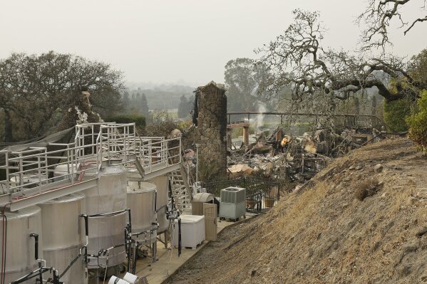 
              Fermentation tanks still stand next to the burned remains of the Signorello Estate winery Tuesday, Oct. 10, 2017, in Napa, Calif. Worried California vintners surveyed the damage to their vineyards and wineries Tuesday after wildfires swept through several counties whose famous names have become synonymous with fine food and drink. (AP Photo/Eric Risberg)
            