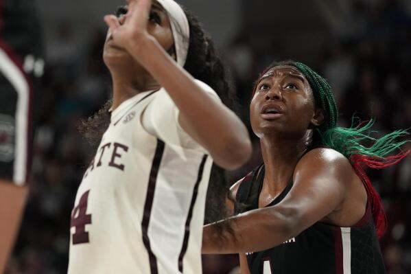 South Carolina forward Aliyah Boston (4) right, pushes away Mississippi State forward Jessika Carter as she sets up to pull in a rebound during the second half of an NCAA college basketball game in Starkville, Miss., Sunday, Jan. 8, 2023. South Carolina won 58-51. (AP Photo/Rogelio V. Solis)