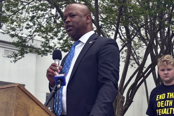 Alabama state Rep. Chris England, D-Tuscaloosa, speaks at a rally for legislation that would allow about 30 death row inmates, who were sentenced to death by judges despite a jury's recommendation of life imprisonment, to receive new sentences, , Thursday, March 21, 2024, in Montgomery, Ala. Alabama in 2017 ended the practice of allowing judges to override sentencing recommendations in death penalty cases, but the change was not retroactive. (AP Photo/Kim Chandler)