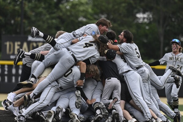 FILE - Wake Forest celebrates after winning an NCAA college baseball tournament super regional game against Alabama, Sunday, June 11, 2023, in Winston-Salem, N.C. The Demon Deacons are coming off the best season in program history and their first CWS appearance since 1955, and the good times are expected to continue. (AP Photo/Matt Kelley, File)