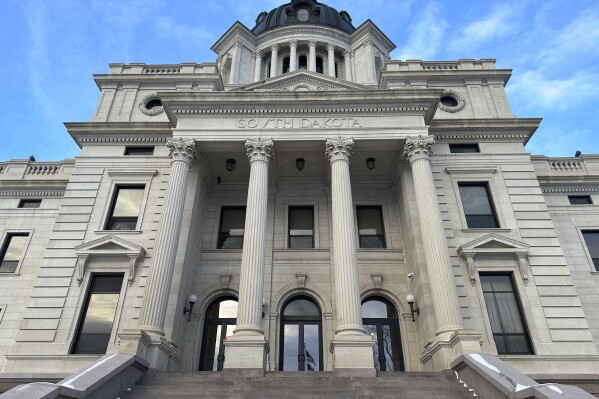 FILE - The front of the South Dakota Capitol in Pierre, S.D., is seen Jan. 10, 2024. Two bills are on their way to Republican Gov. Kristi Noem to add artificial intelligence-generated images and videos to the state's laws against child sexual abuse images, and to make the animal sedative xylazine a controlled substance, with veterinary exceptions. (AP Photo/Jack Dura, File)