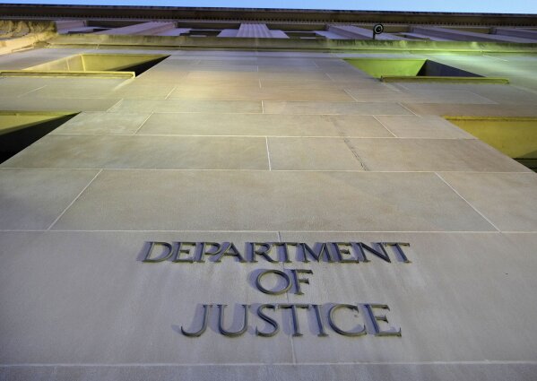 FILE - In this May 14, 2013, file photo, the Department of Justice headquarters building in Washington is photographed early in the morning. The Justice Department says Tuesday, July 2, 2019, the 2020 Census is moving ahead without a question about citizenship. (AP Photo/J. David Ake, File)