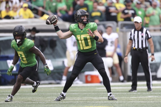 Oregon quarterback Bo Nix looks to pass against Colorado during the first half of an NCAA football game, Saturday, Sept. 23, 2023, in Eugene, Ore. (AP Photo/Amanda Loman)