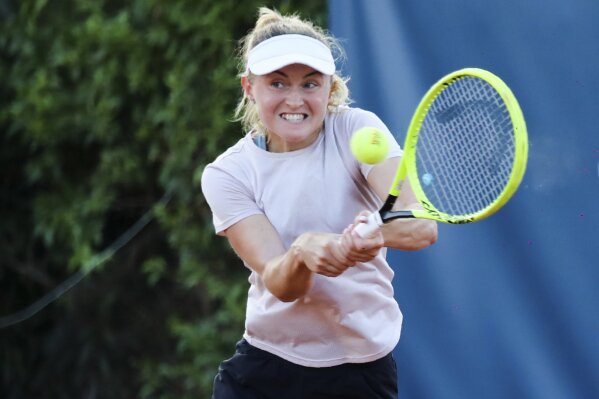 Belarus' Aljaksandra Sasnovich returns the ball to Italy's Jasmine Paolini during the Palermo Ladies Open tennis tournament in Palermo, Italy, Wednesday, Aug. 5, 2020. Tour-level tennis resumed after a five-month enforced break on Monday, and players at the Palermo Ladies Open had to handle their own towels and not shake hands of opponents. The strict rules because of the coronavirus included no showers on site, and no autographs or photos with fans. Players in the singles main draw come from 15 countries, all in Europe. (Palermo Ladies Open via AP)