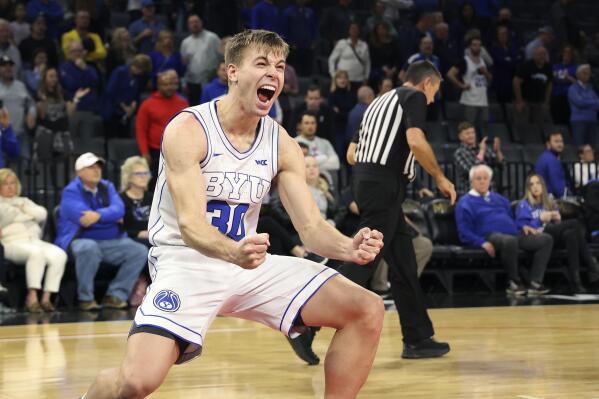 BYU guard Dallin Hall (30) reacts to his team's win at the end of an NCAA college basketball game against Creighton Saturday, Dec. 10, 2022, in Las Vegas. BYU won 83 to 80. (AP Photo/Ronda Churchill)