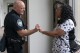 Knoxville Deputy Police Chief Tony Willis talks with Terry Walker-Smith after a meeting of the Violence Reduction Leadership Committee on Thursday, Aug. 3, 2023, in Knoxville, Tenn. (AP Photo/George Walker IV)