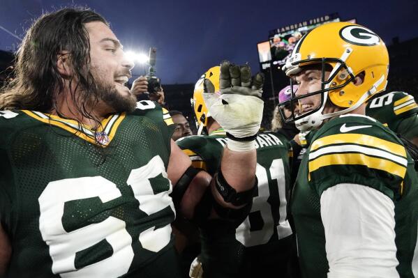 Green Bay Packers place kicker Mason Crosby, right, celebrates with teammate offensive tackle David Bakhtiari, left, after kicking a 31-yard field goal during overtime in an NFL football game against the New England Patriots, Sunday, Oct. 2, 2022, in Green Bay, Wis. The Packers won 27-24. (AP Photo/Morry Gash)