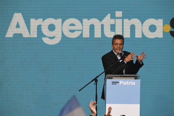 Sergio Massa, Economy Minister and presidential candidate for the ruling party, speaks to supporters at his campaign headquarters after general elections in Buenos Aires, Argentina, Sunday, Oct. 22, 2023. Massa held the lead in early results and is poised to face off Javier Milei in a second round Nov. 19. (AP Photo/Gustavo Garello)