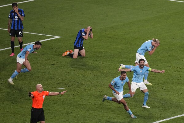 Manchster City players celebrate their 1-0 win at the end of the Champions League final soccer match against Inter Milan in Istanbul, Turkey, June 10, 2023. (AP Photo/Thanassis Stavrakis)
