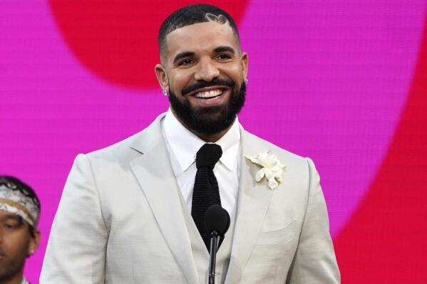 FILE - Drake accepts the artist of the decade award at the Billboard Music Awards on Sunday, May 23, 2021, at the Microsoft Theater in Los Angeles. Drake wants no part in competing for a Grammy. The four-time Grammy winner and his management asked the Recording Academy to withdraw his two nominations from the final-round ballot, a person familiar with the situation told The Associated Press, Monday, Dec. 6, 2021. The person said that Drake’s request was honored by the academy. (AP Photo/Chris Pizzello, File)