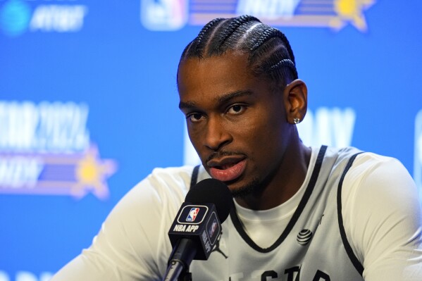 Oklahoma City Thunder guard Shai Gilgeous-Alexander answers a question during media day at the NBA All-Star basketball game in Indianapolis, Saturday, Feb. 17, 2024. (AP Photo/Michael Conroy)