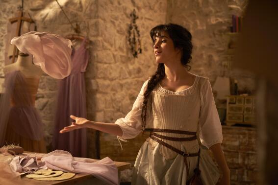 This image released by Amazon shows Camila Cabello in a scene from "Cinderella." (Kerry Brown/Amazon via AP)