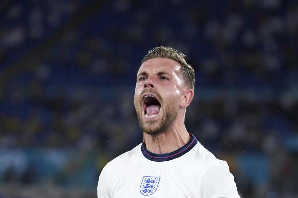 England's Jordan Henderson celebrates after scoring his side's fourth goal during the Euro 2020 soccer championship quarterfinal match between Ukraine and England at the Olympic stadium in Rome, Saturday, July 3, 2021. (AP Photo/Ettore Ferrari, Pool)