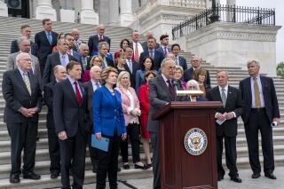 Senate Majority Leader Chuck Schumer, D-N.Y., and other Democrats express their outrage at a news report by Politico that a Supreme Court draft opinion suggests the justices could be poised to overturn the landmark 1973 Roe v. Wade case that legalized abortion nationwide, at the Capitol in Washington, Tuesday, May 3, 2022. (AP Photo/J. Scott Applewhite)