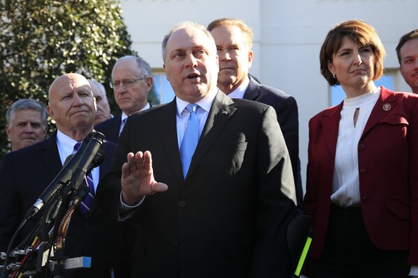 
              Rep. Rep. Steve Scalise, R-La., center, together with Rep. Kevin Brady, R-Texas, left, and Rep. Cathy McMorris Rodgers, R-Wa., right, and other Republican members of Congress speaks to reporters outside the West Wing of the White House following a meeting with President Donald Trump at the White House in Washington, Tuesday, March 26, 2019. (AP Photo/Manuel Balce Ceneta)
            