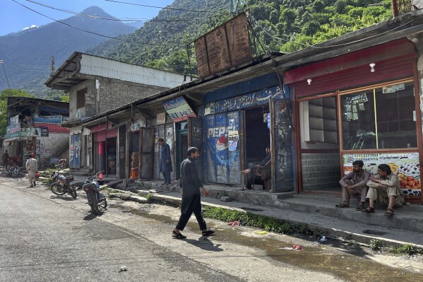 Shopkeepers wait for customers at the main bazaar, a day after the ceasefire between Indian and Pakistan was announced, in Jura, near Line of Control, in Neelum Valley, a district of Pakistan's administered Kashmir, Sunday, May 11, 2025. (AP Photo/M.D. Mughal)