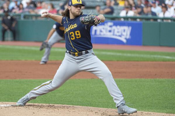 Milwaukee Brewers starting pitcher Corbin Burnes delivers against the Cleveland Indians during the first inning of a baseball game in Cleveland, Saturday, Sept. 11, 2021. (AP Photo/Phil Long)