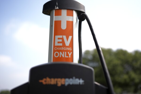 An EV charging station is seen Thursday, May 9, 2024, in San Antonio. Many Americans still aren’t sold on going electric for their next car purchase. High prices and a lack of easy-to-find charging stations are major sticking points, a new poll shows. (AP Photo/Eric Gay)