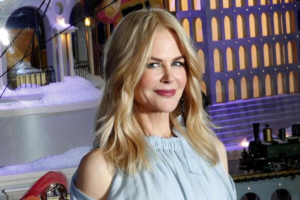 FILE - In this Nov. 7, 2017, file photo, Australian actress Nicole Kidman poses as she inaugurates the shop windows for the Christmas season at the Le Printemps Haussmann department store in Paris. Hong Kong's recent quarantine exemption for Kidman has drawn criticism from the city's lawmakers as the city tightens entry restrictions for international travelers in its "zero Covid" strategy. The government said in a statement Thursday, Aug. 19, 2021, that it had granted the exemption “for the purpose of performing designated professional work.” (AP Photo/Christophe Ena, File)