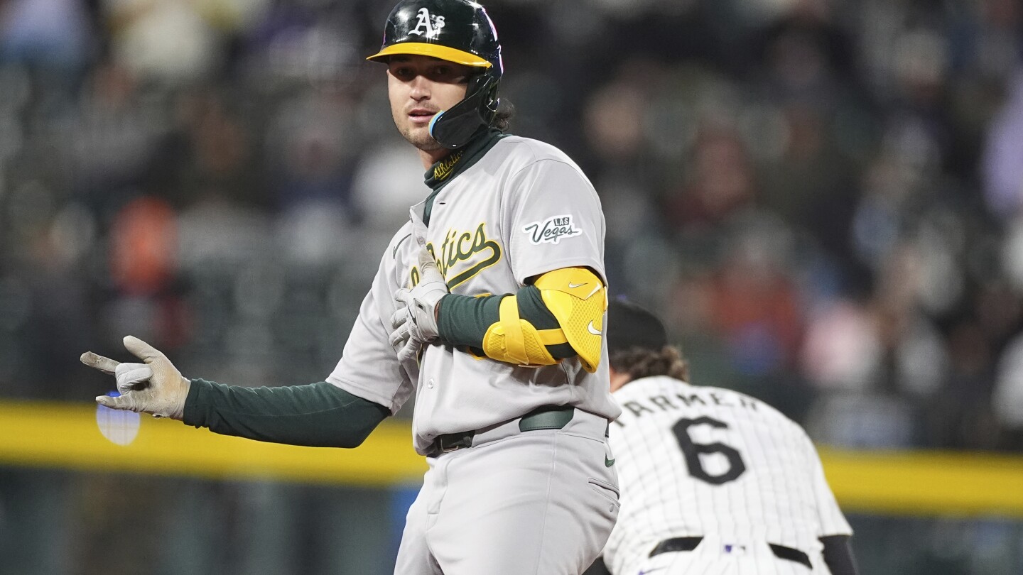 Wilson atones for hitting into triple play with 2-run double as Athletics beat reeling Rockies 7-4