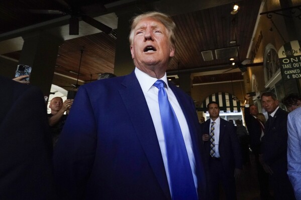 Former President Donald Trump visits Café du Monde in New Orleans, Tuesday, July 25, 2023. (AP Photo/Gerald Herbert)