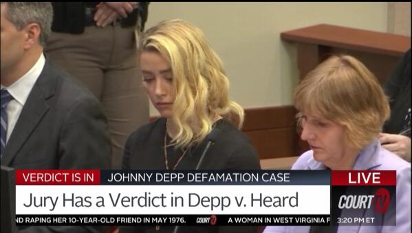 In this screen grab from video, Amber Heard reacts, with her lawyer Elaine Bredehoft at right, as the verdict is read in the courtroom in the Fairfax County Circuit Courthouse in Fairfax, Va., Wednesday, June 1, 2022. Actor Johnny Depp sued his ex-wife Heard for libel in Fairfax County Circuit Court after she wrote an op-ed piece in The Washington Post in 2018 referring to herself as a "public figure representing domestic abuse."(Court TV, via AP, Pool)