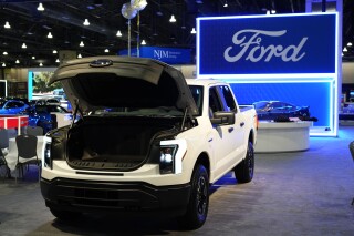 FILE - The Ford F-150 Lightning sits on display at the Philadelphia Auto Show, Jan. 27, 2023, in Philadelphia. Massive battery plants planned in Tennessee and Kentucky for Ford's electric vehicles are on track to receive up to a $9.2 billion federal loan, in what would be the biggest award under the U.S. Department of Energy's loan program since President Joe Biden took office. (AP Photo/Matt Rourke, File)