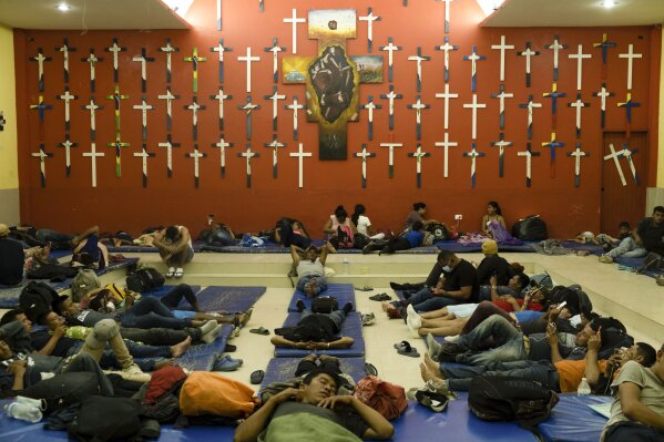 Central American migrants rest at La 72 shelter in Tenosique, Tabasco state, Mexico, Tuesday, Feb. 9, 2021. When Guatemalan authorities blocked a migrant caravan last month drawing international attention the flow of migrants might have seemed to slow down, but a growing number of small groups continue to flow daily from Central America into Mexico. (AP Photo/Isabel Mateos)