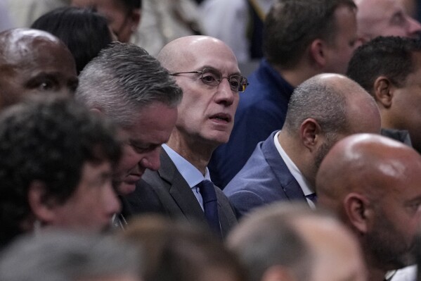 NBA commissioner Adam Silver watches the Washington Wizards play the Indiana Pacers during the first half of an NBA basketball game in Indianapolis, Wednesday, Oct. 25, 2023. (AP Photo/Michael Conroy)