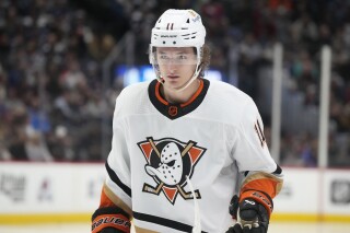 FILE - Anaheim Ducks' Trevor Zegras (11) plays in the second period of an NHL hockey game Thursday, Jan. 26, 2023, in Denver. Ducks forward Trevor Zegras is one of several restricted free agents without a contract for the upcoming NHL season. Zegras was the team's leading scorer last season with 65 points. (AP Photo/David Zalubowski, File)