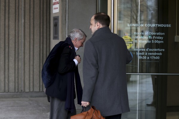 Defence lawyer Peter Ketcheson (right) holds the door for defence lawyer Christopher Hicks at the London courthouse to attend the sentencing hearing of Nathaniel Veltman in London, Ont., Thursday, Feb. 22, 2024. (Nicole Osborne /The Canadian Press via 番茄直播)